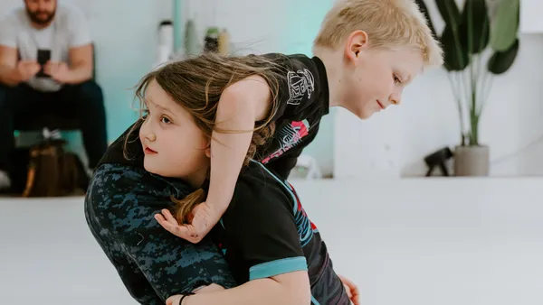 Two kids sparring during the Kids 7+ BJJ class
